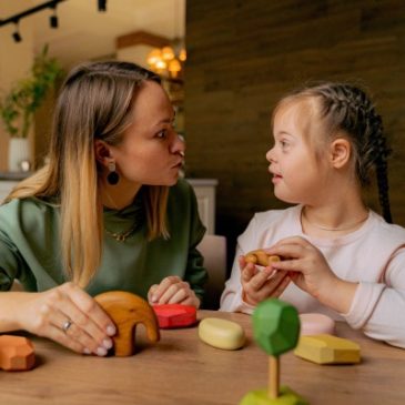 Lady with a child with Down's syndrome.